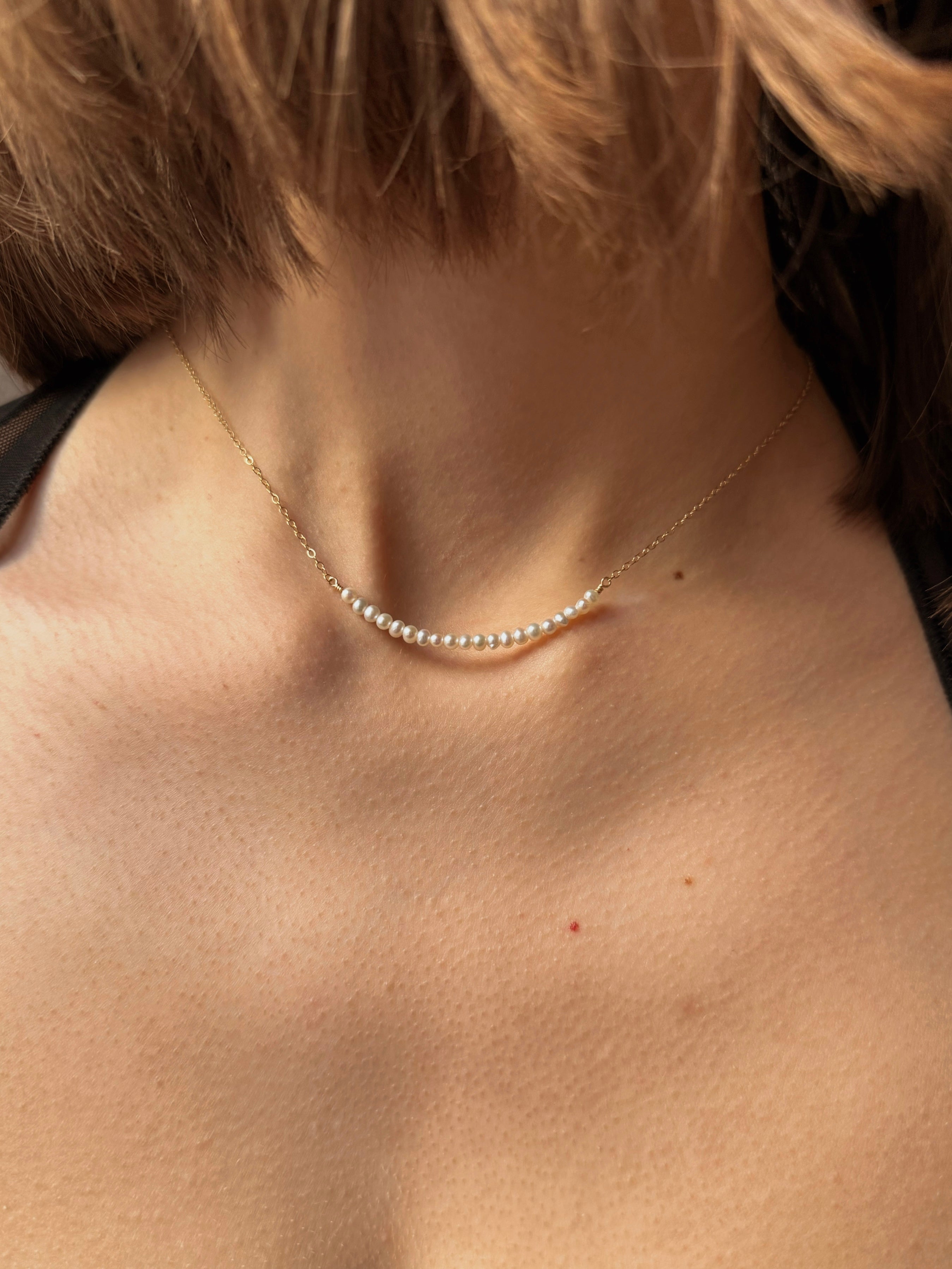 Smiley pearl necklace