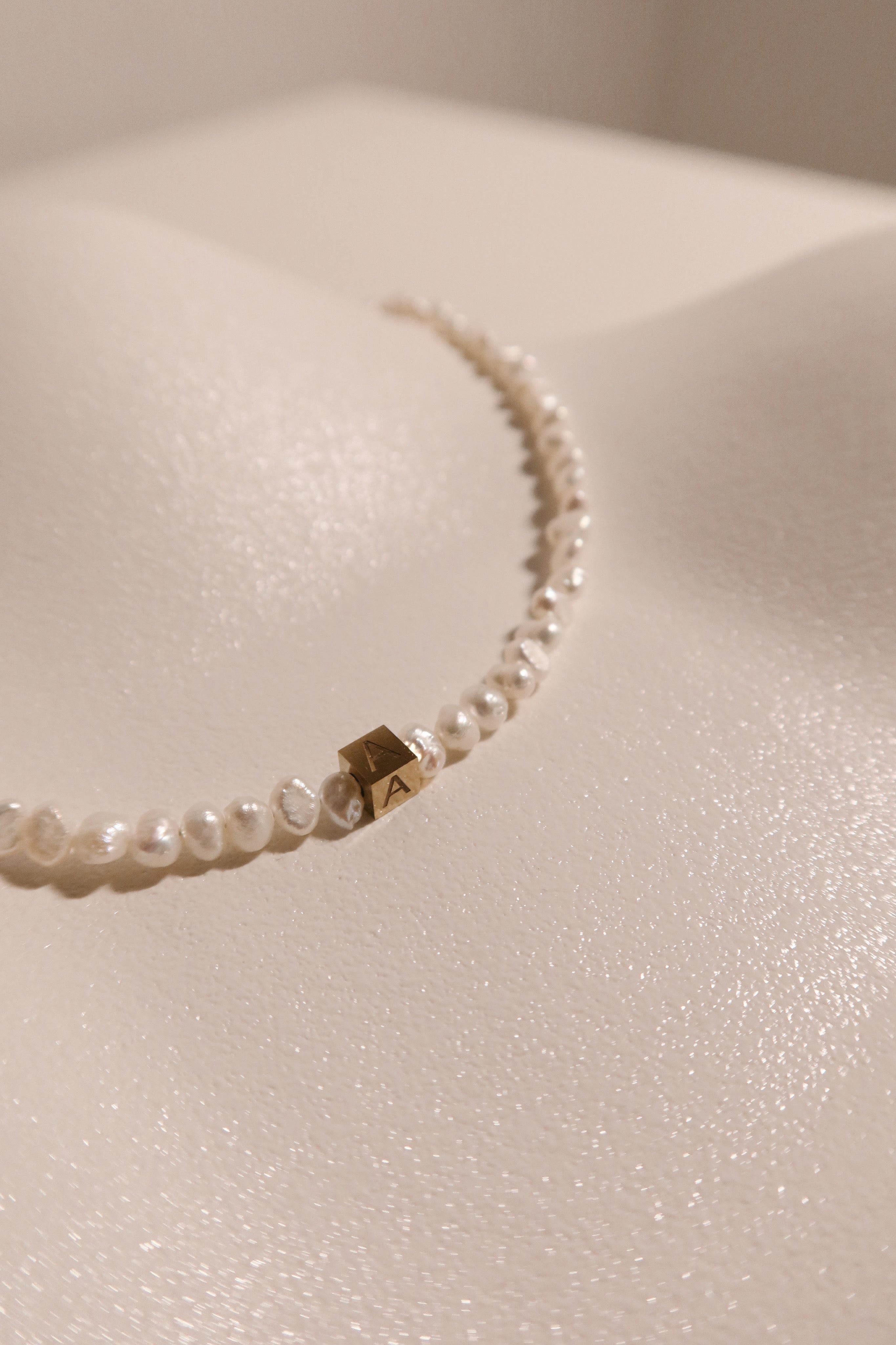 Rocks Initial pearl necklace