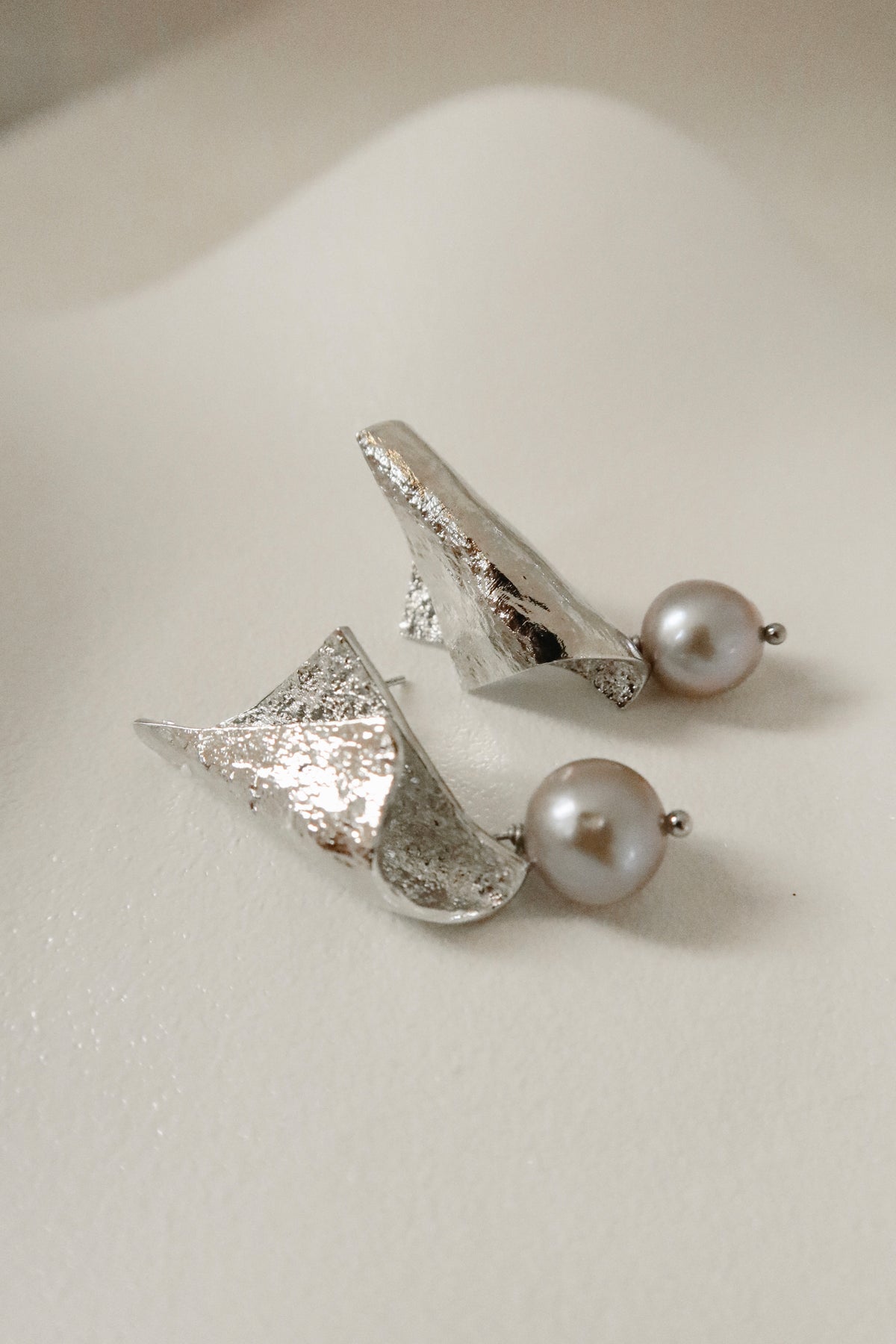 Bent Silver pearl earrings